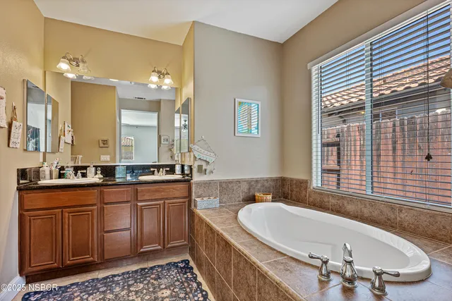 a bathroom with a tub and a shower