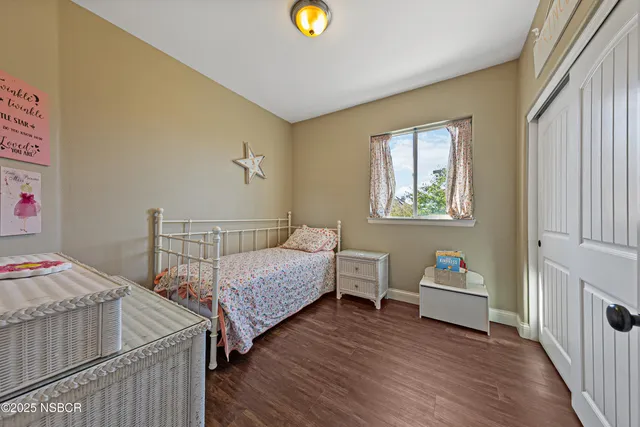 a view of empty room with large windows