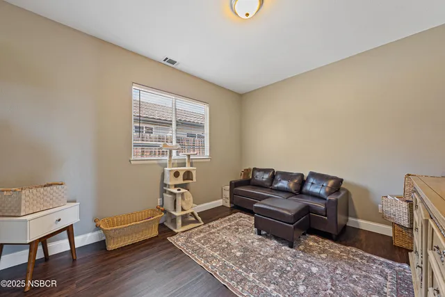 a bathroom with a granite countertop sink mirror toilet and bathtub