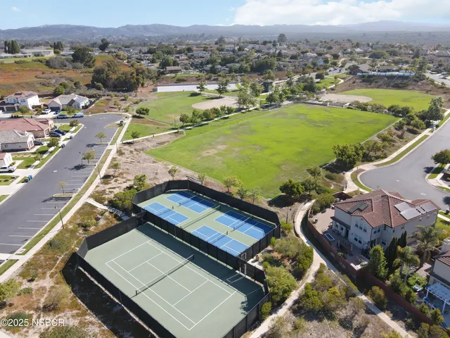 an aerial view of a house with a swimming pool yard and outdoor seating