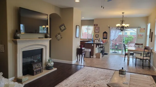a living room with furniture a table and chairs