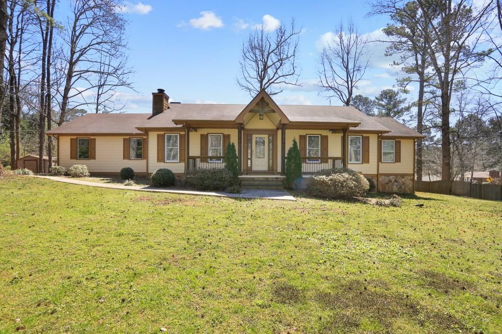 3198 Robin Lane Northwest Duluth, GA 30096 - Photo 1 of 1 a front view of a house with a yard