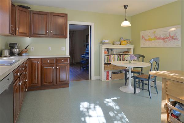 72 Grapevine Road Wenham, MA 01984 - Photo 18 of 22 a kitchen with cabinets and chairs