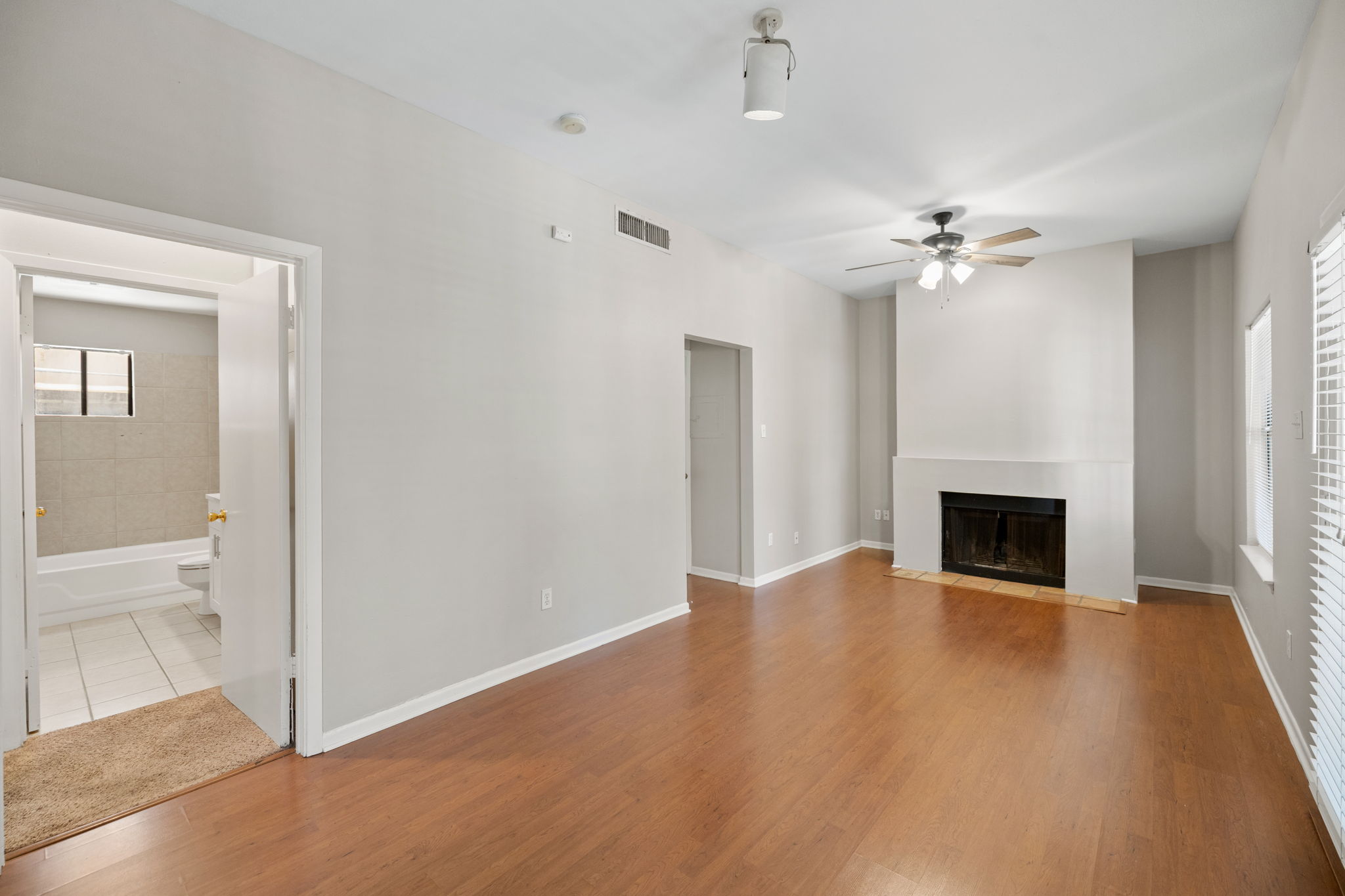 712 Graham Place, Unit 203 Austin, TX 78705 - Photo 4 of 30 a view of an empty room with a fireplace