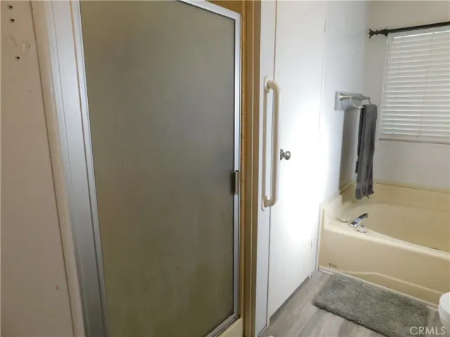 a bathroom with a tub and sink