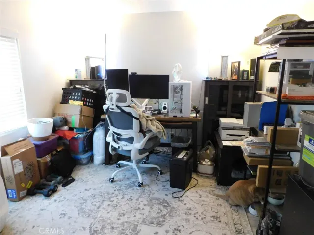 a view of a workspace with furniture