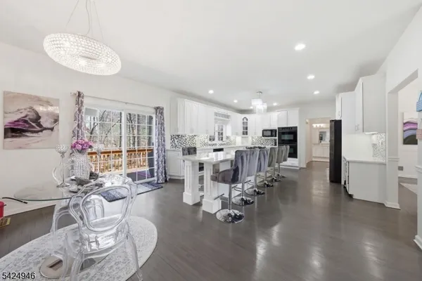 a living room with furniture kitchen and kitchen view