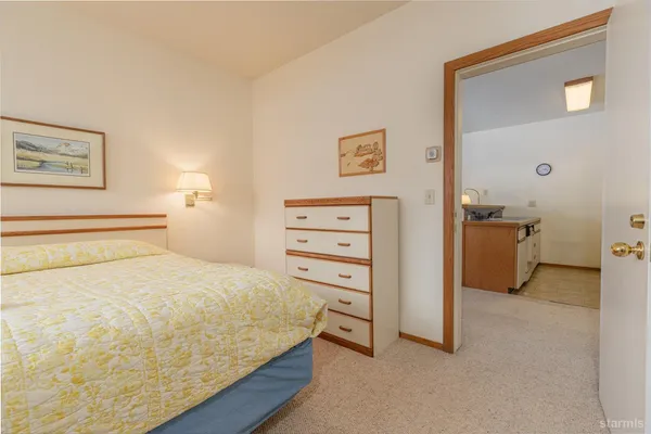 a bedroom with a bed and a cabinets