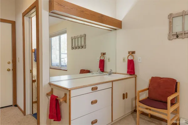 a room with a window and a chair