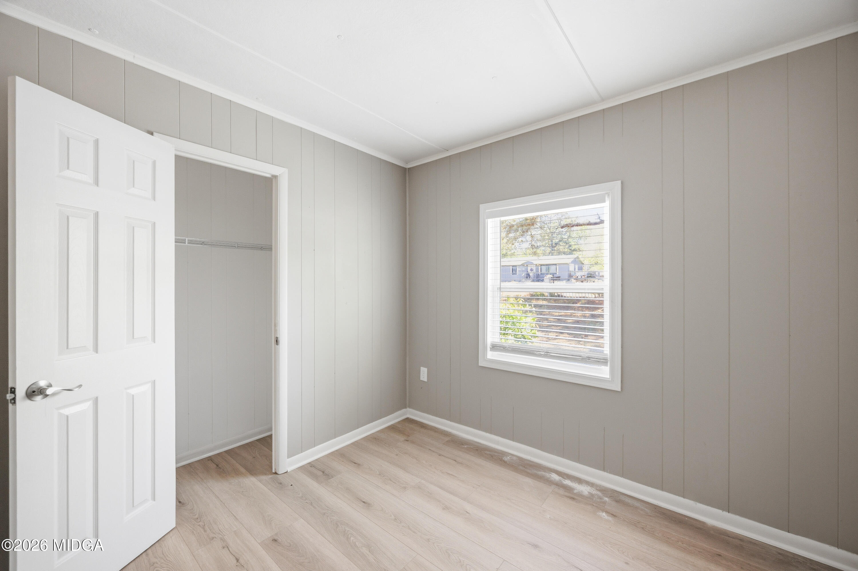 427 Gun Club Road Fort Valley, GA 31030 - Photo 15 of 26 a view of an empty room with closet and a window