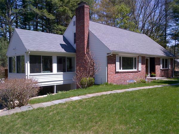 273 Conant Road Weston, MA 02493 - Photo 2 of 12 a front view of a house with a garden