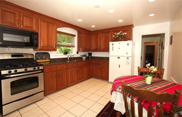 273 Conant Road Weston, MA 02493 - Photo 3 of 12 a kitchen with a sink stove and refrigerator
