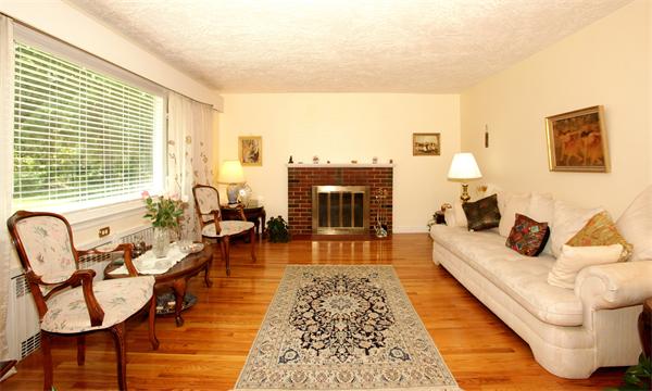 273 Conant Road Weston, MA 02493 - Photo 6 of 12 a living room with furniture and a fireplace