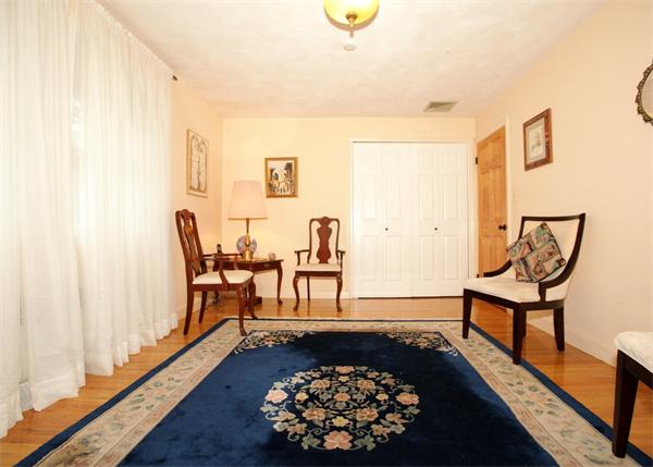 273 Conant Road Weston, MA 02493 - Photo 8 of 12 a living room with furniture and a rug