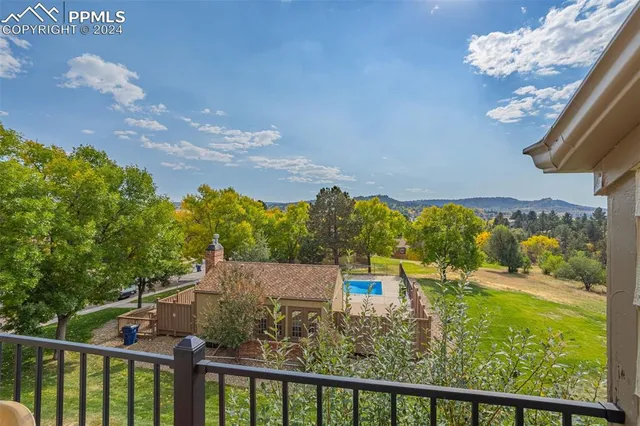 a view of a swimming pool with a yard