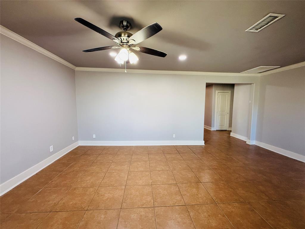 529 Northwest Private Road 147 Rice, TX 75155 - Photo 13 of 20 Spare room with ornamental molding and tile patterned floors