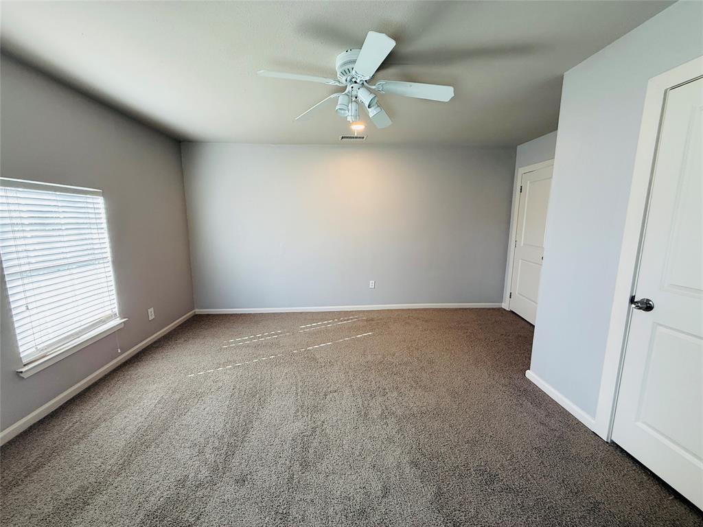 529 Northwest Private Road 147 Rice, TX 75155 - Photo 15 of 20 Carpeted spare room with baseboards and a ceiling fan