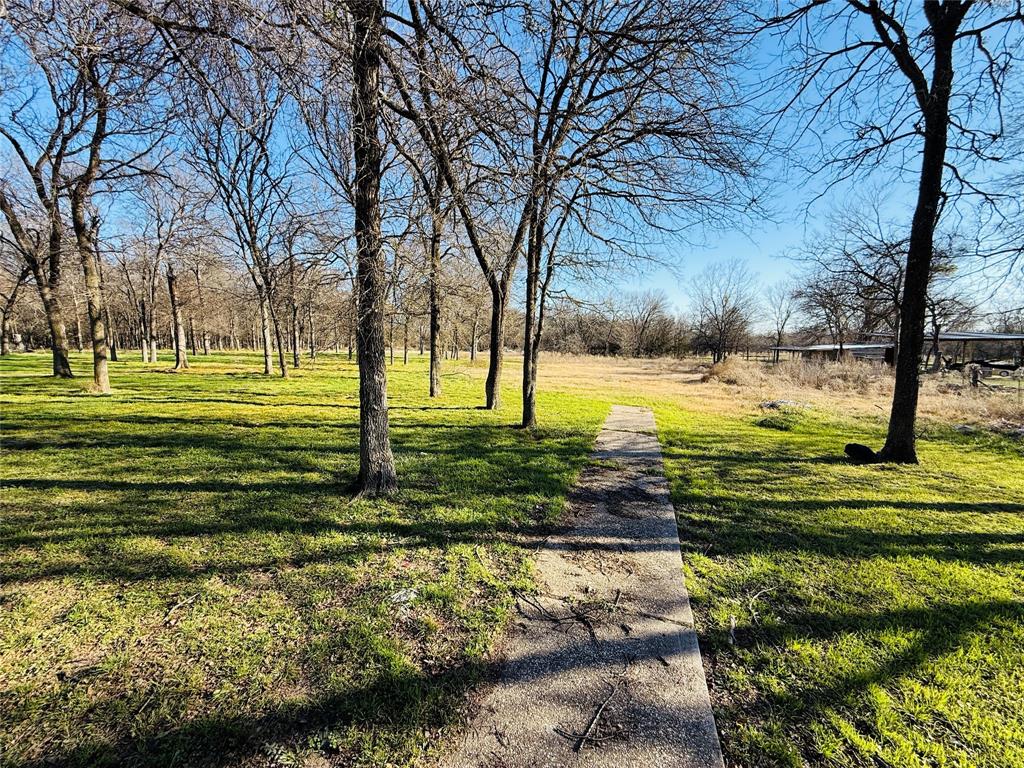 529 Northwest Private Road 147 Rice, TX 75155 - Photo 20 of 20 View of property's community with a lawn