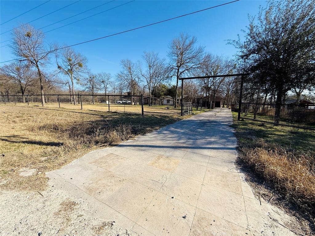 529 Northwest Private Road 147 Rice, TX 75155 - Photo 5 of 20 View of concrete surface with a gate