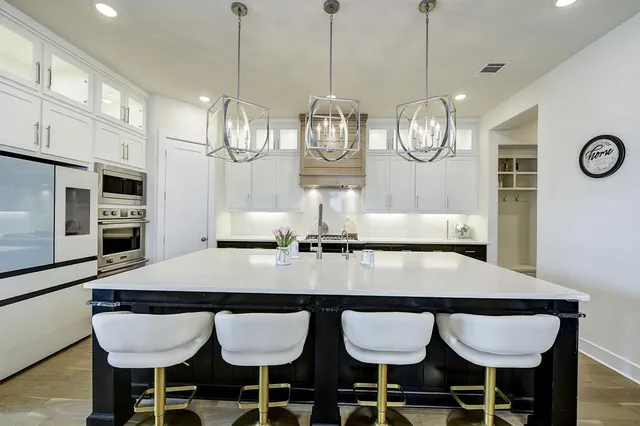 a view of a dining room with furniture and chandelier