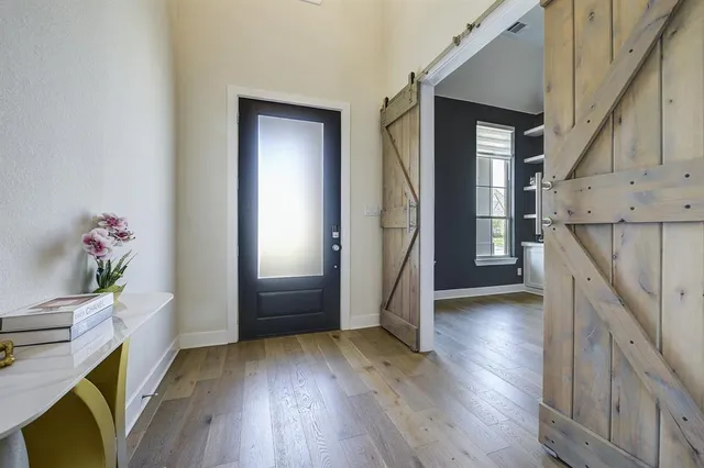 a view of entryway with wooden floor