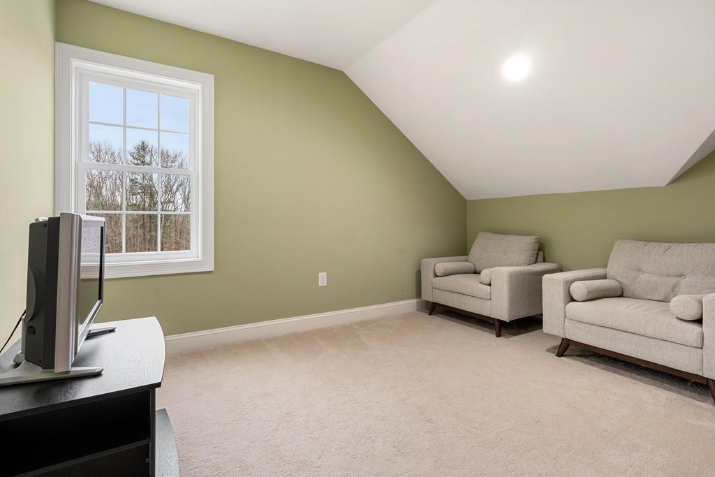 76 Deerfoot Road Southborough, MA 01772 - Photo 11 of 25 a living room with furniture and a window