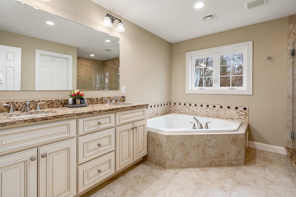 76 Deerfoot Road Southborough, MA 01772 - Photo 12 of 25 a bath room with a sink and a mirror