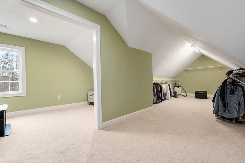 76 Deerfoot Road Southborough, MA 01772 - Photo 13 of 25 a view of a livingroom with a staircase