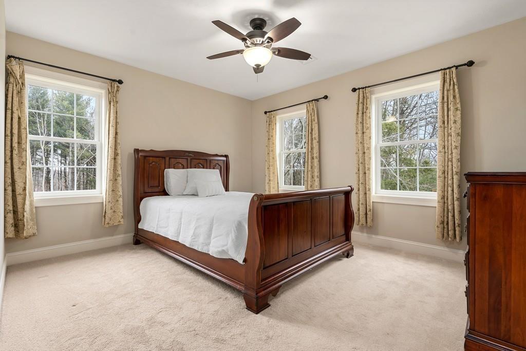 76 Deerfoot Road Southborough, MA 01772 - Photo 14 of 25 a bed sitting in a spacious bedroom next to a window