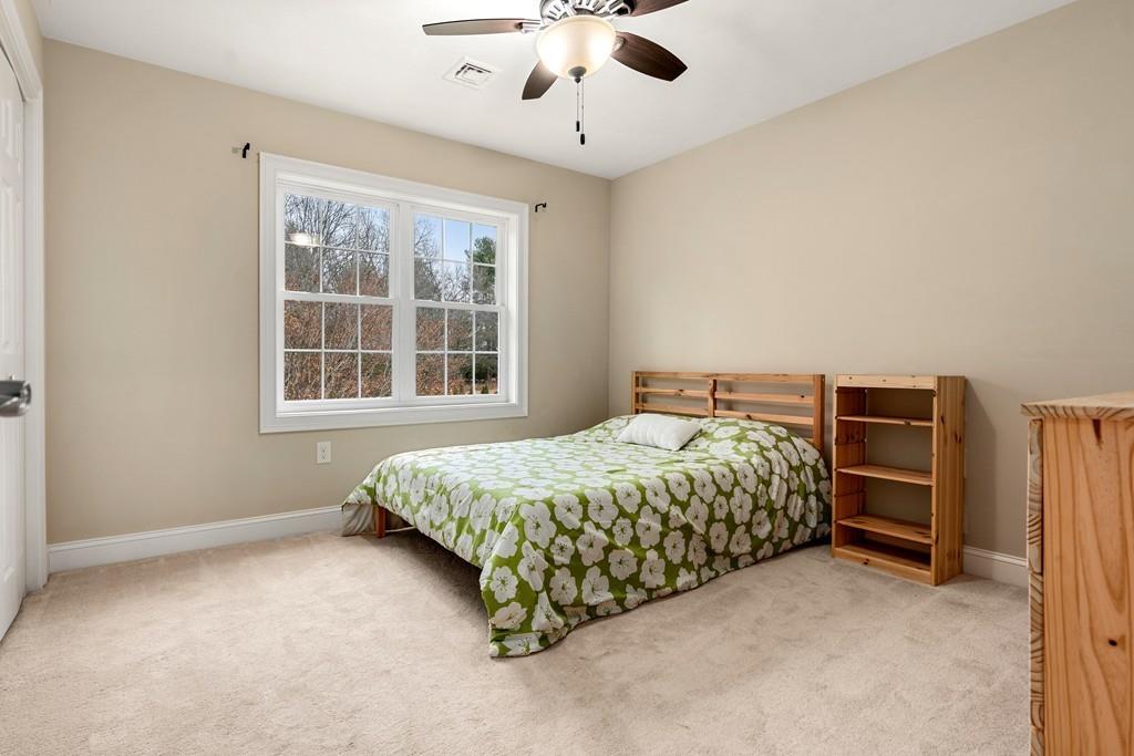 76 Deerfoot Road Southborough, MA 01772 - Photo 15 of 25 a bedroom with a bed closet and a window
