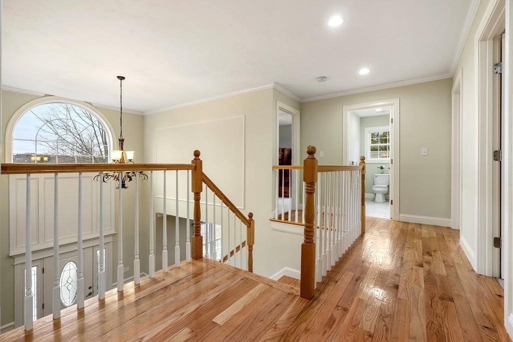 76 Deerfoot Road Southborough, MA 01772 - Photo 18 of 25 a view of a hallway with wooden floor and stairs