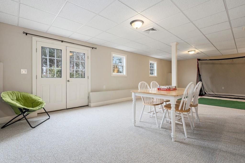 76 Deerfoot Road Southborough, MA 01772 - Photo 19 of 25 a view of a livingroom with furniture and a table chair