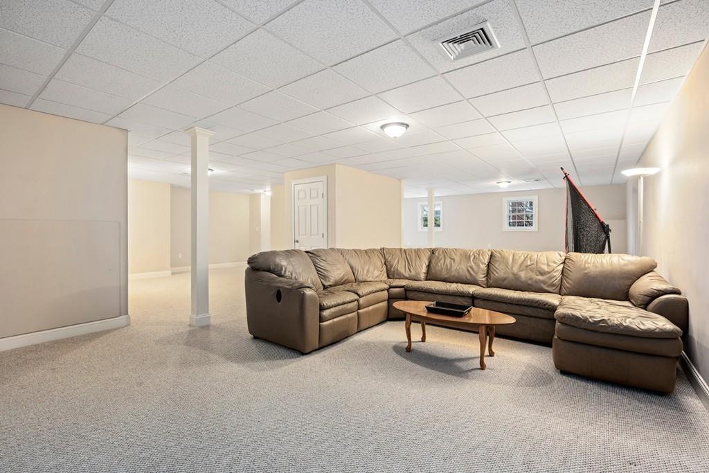 76 Deerfoot Road Southborough, MA 01772 - Photo 21 of 25 a living room with furniture and a couch