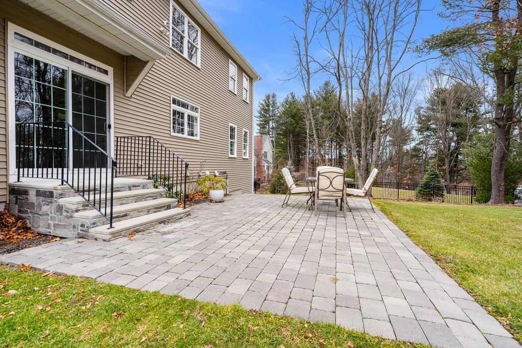 76 Deerfoot Road Southborough, MA 01772 - Photo 24 of 25 a view of a chair and tables on the patio