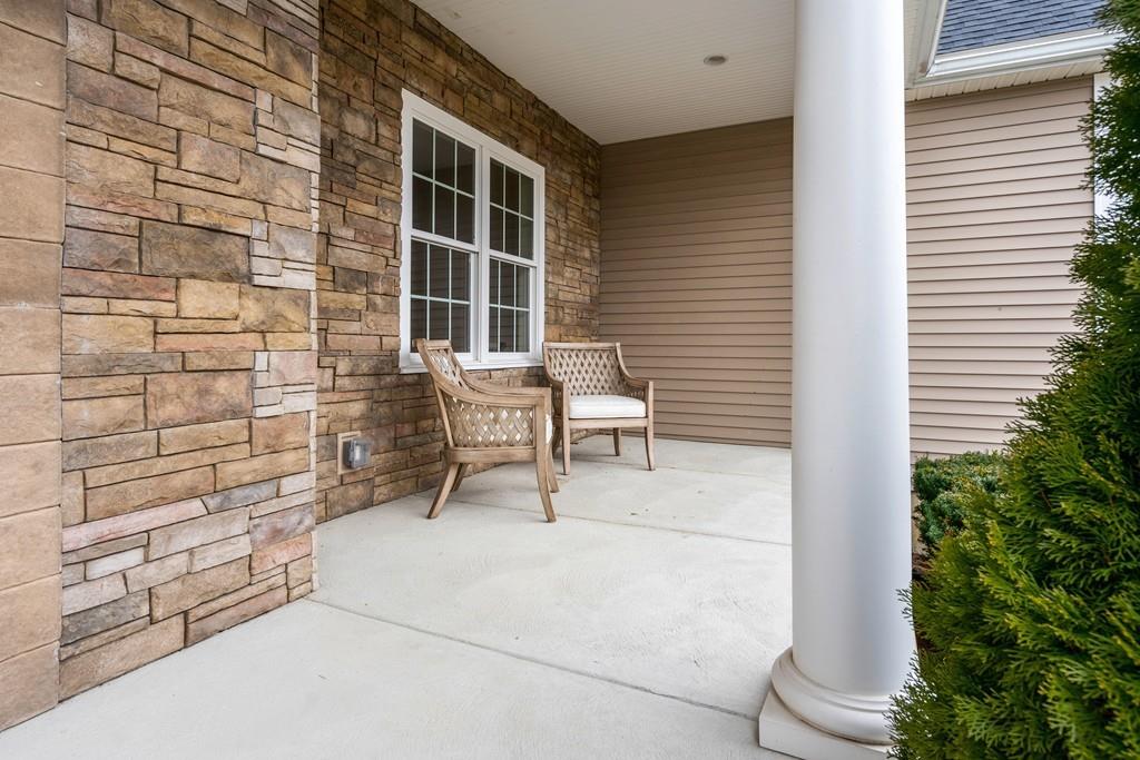 76 Deerfoot Road Southborough, MA 01772 - Photo 25 of 25 a building outdoor space with patio furniture and potted plants