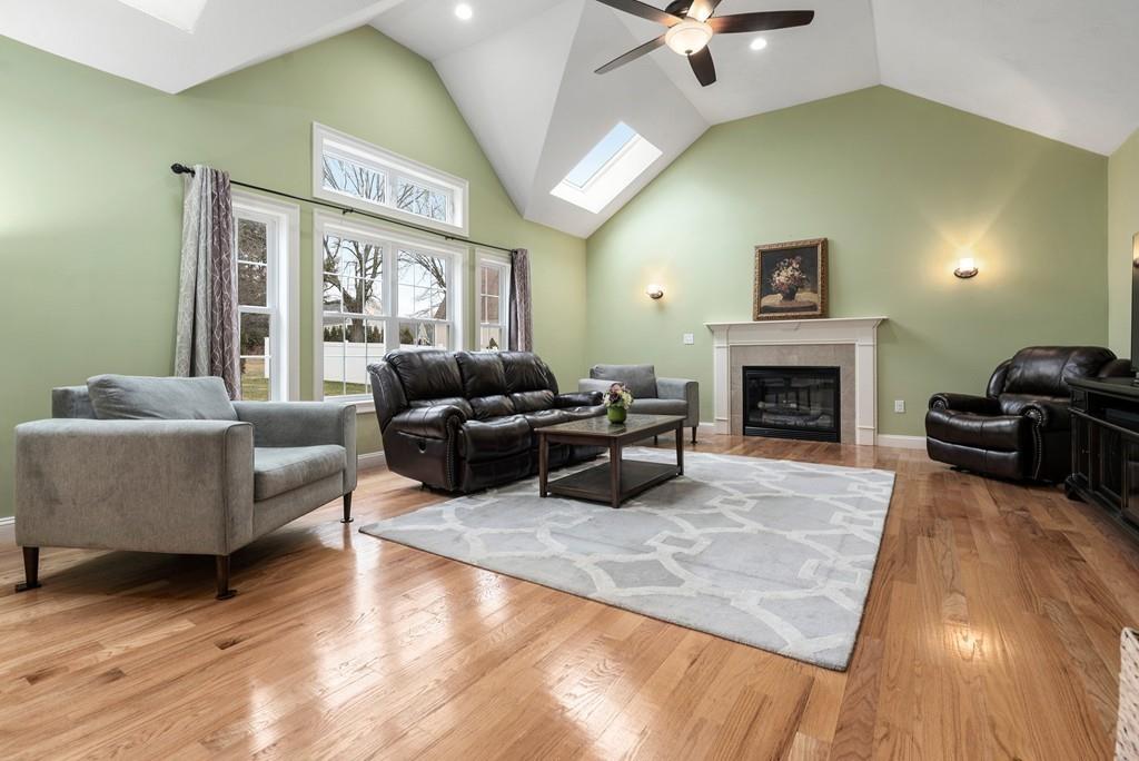 76 Deerfoot Road Southborough, MA 01772 - Photo 5 of 25 a living room with furniture window and a fireplace