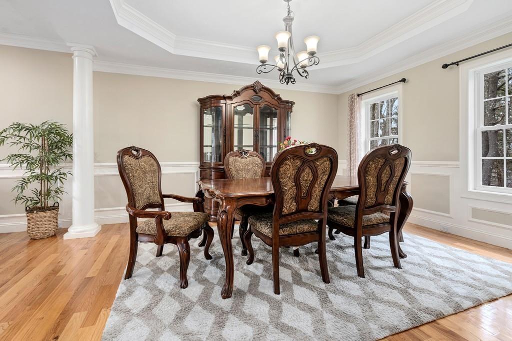 76 Deerfoot Road Southborough, MA 01772 - Photo 6 of 25 a dining room with furniture a chandelier and wooden floor