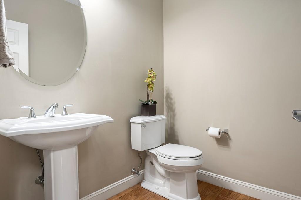 76 Deerfoot Road Southborough, MA 01772 - Photo 8 of 25 a bathroom with a sink a toilet and mirror