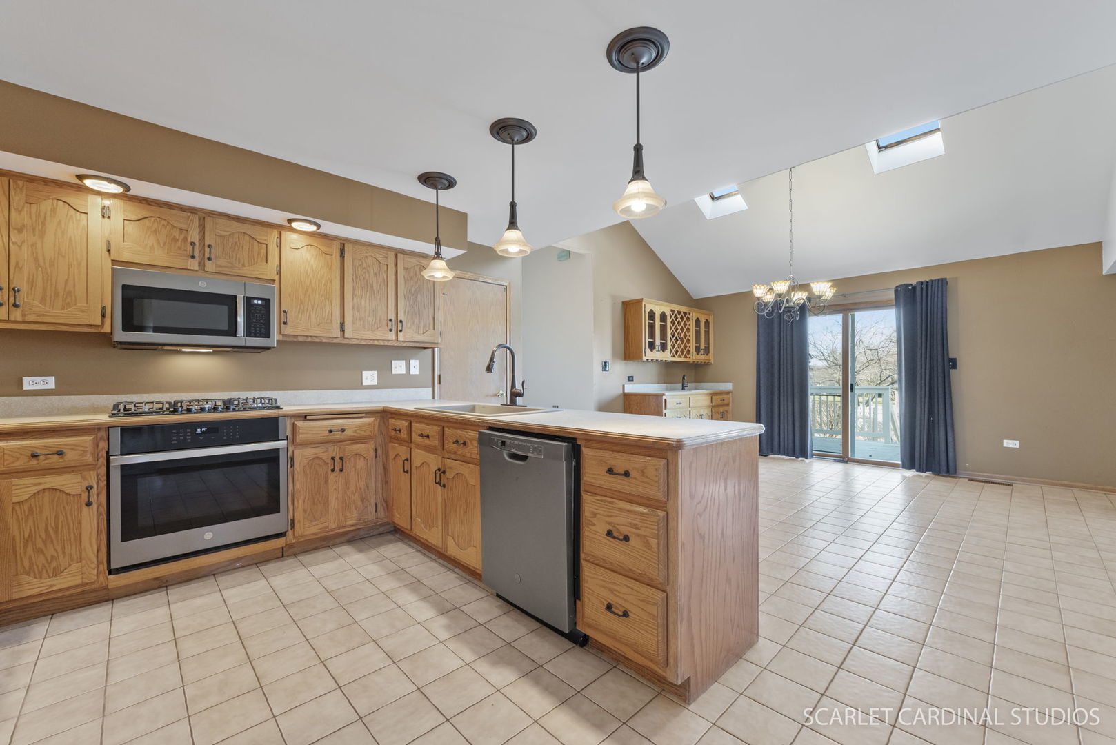20428 South Grand Prairie Lane Frankfort, IL 60423 - Photo 8 of 29 a large kitchen with stainless steel appliances granite countertop a stove top oven a sink dishwasher a dining table and chairs with wooden floor