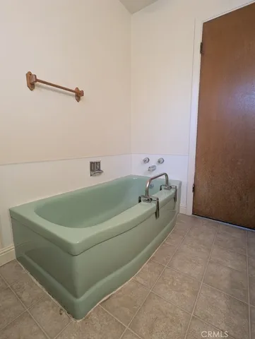 a bathroom with a tub and a shower