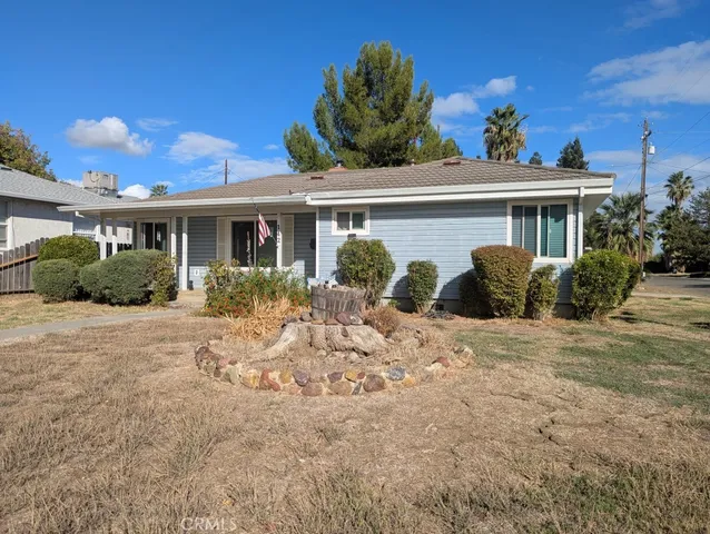 a view of a house with a yard and plants
