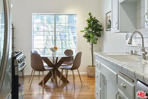 a dining room with furniture and window