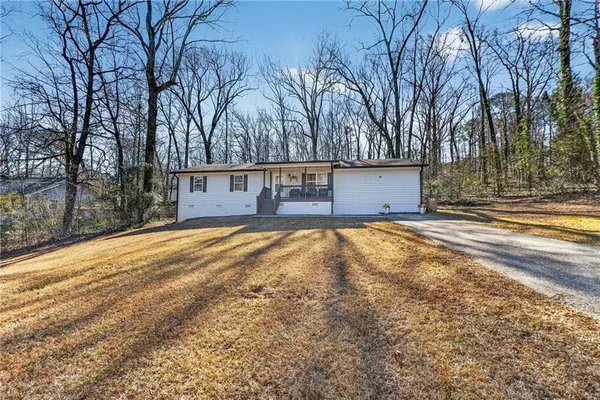 front view of a house with a yard