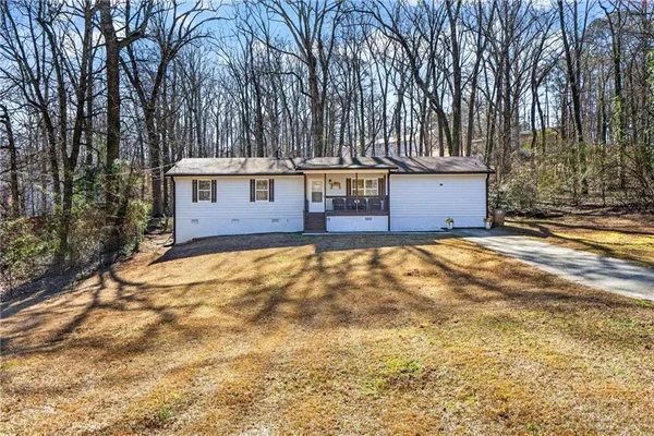 front view of a house with a yard