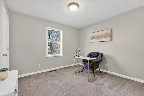 a workspace with furniture and window
