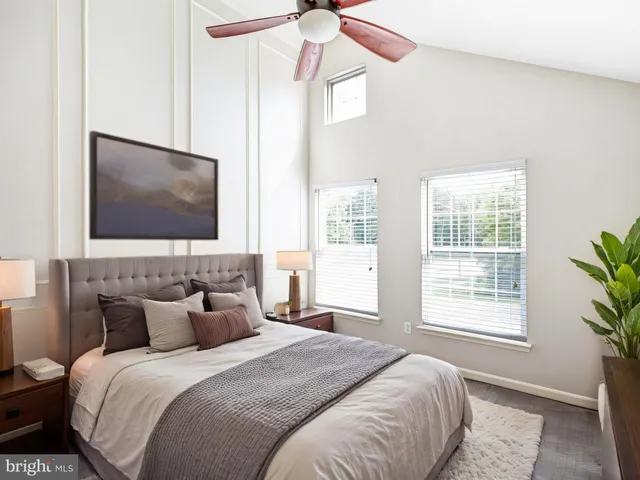 a bedroom with bed and window