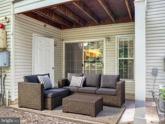 a outdoor living space with furniture and a potted plant