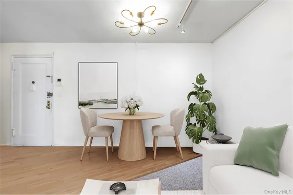 a dining room with furniture and wooden floor