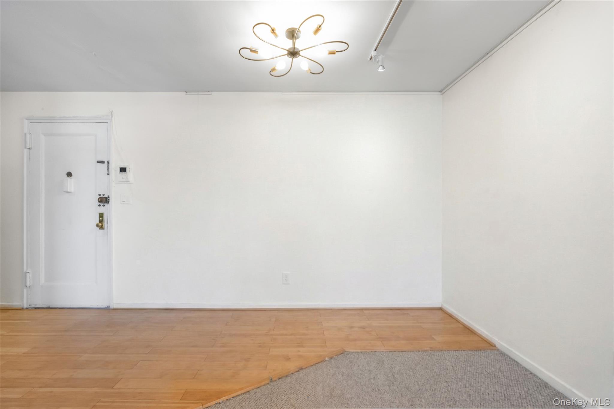 46 Terrace Circle, Unit 3F Great Neck, NY 11021 - Photo 3 of 17 a view of an empty room