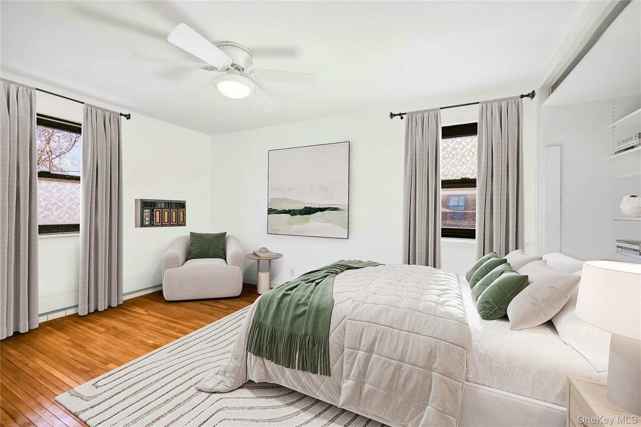 46 Terrace Circle, Unit 3F Great Neck, NY 11021 - Photo 10 of 17 a bedroom with a bed and wooden floor